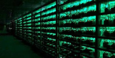A well-organized mining farm with rows of running mining rigs
