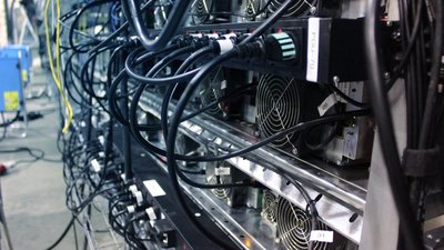 An overview of a large mining farm with multiple rigs