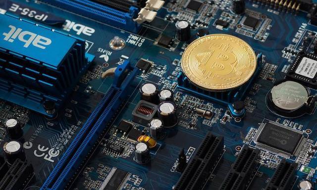 Close-up of a powerful ASIC miner, highlighting its intricate circuit boards and cooling system.